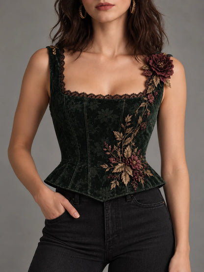Side view of forest green corset top with floral appliqué and gathered sheer sleeve