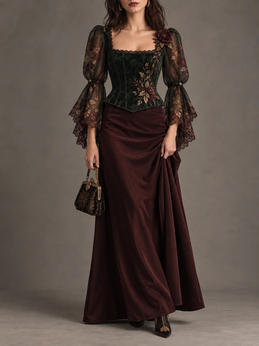 Back view of forest green corset top with floral embroidery and lace-up closure